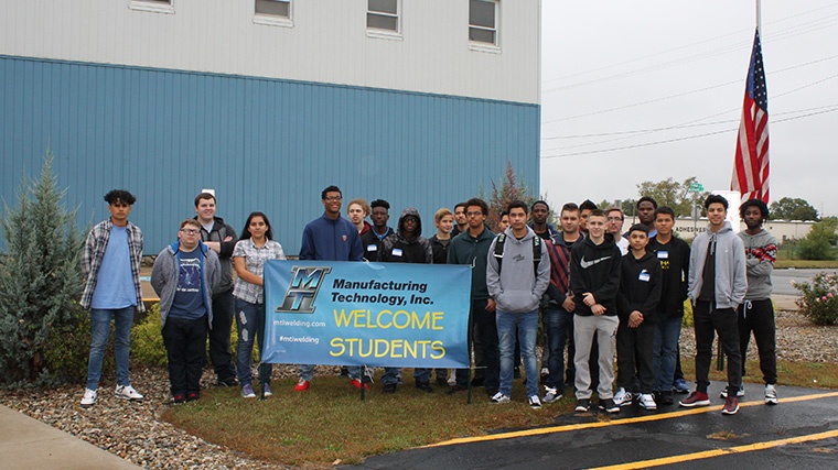 South Bend highschoolers pose in front of MTI in celebration of Manufacturing Day 2017.