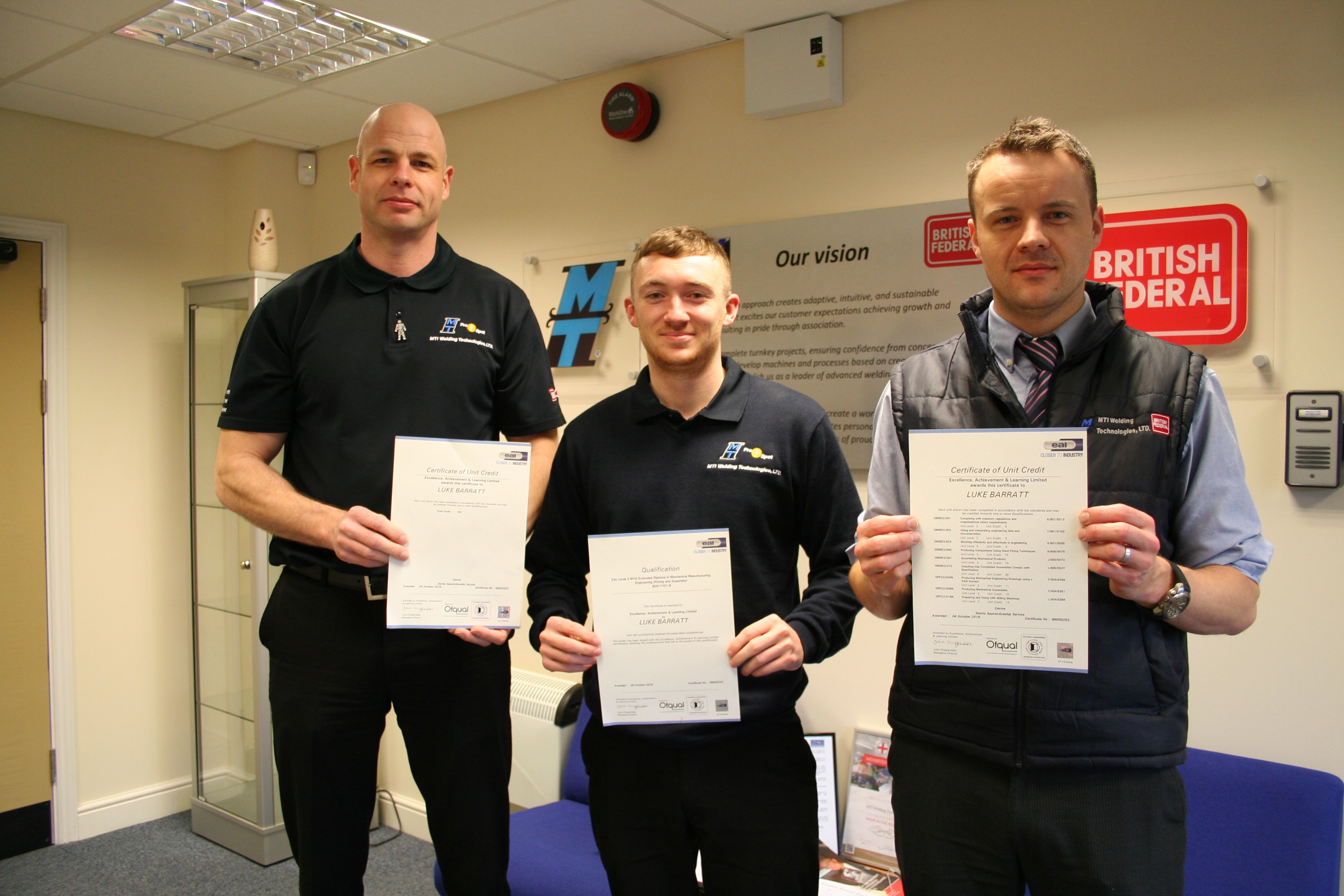 Junior design engineer Luke Barratt pictured with apprentice manager CHris Price and Nick Walford, the head of Luke's new engineering department. 